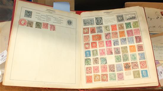 Two stamp albums with worn red covers